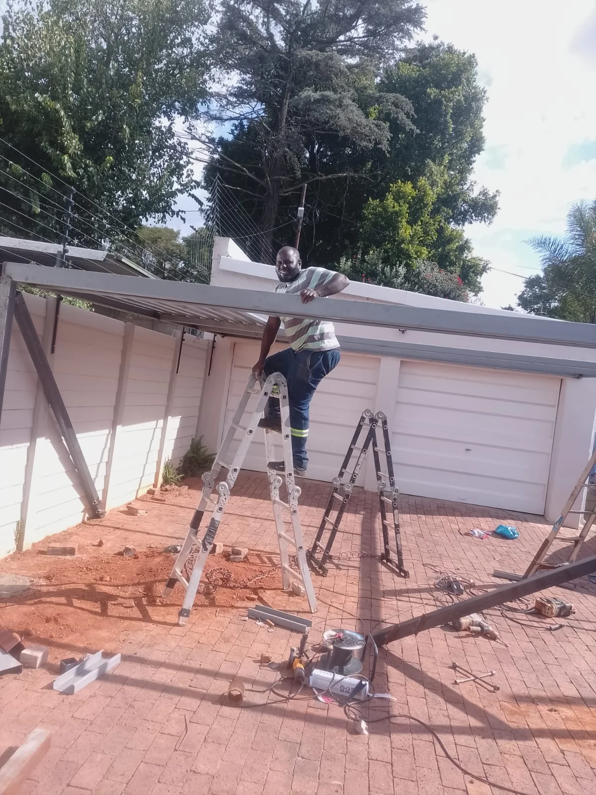 Modern carport structure outside a house with clean lines